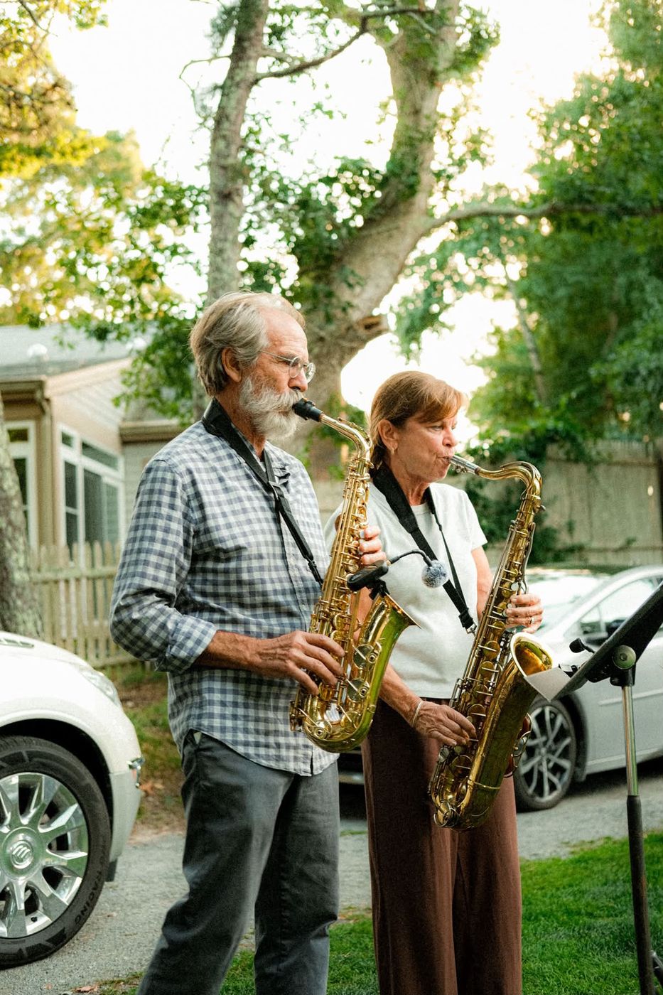 The saxophone players performing at an outdoor party